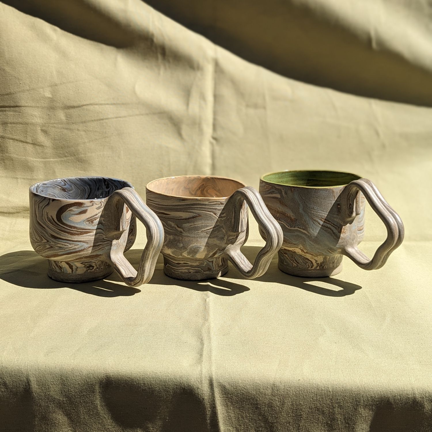 We Nichol: Blue-grey Wavy Handle Mug with Green Interior Glaze (Each sold separately) Product Image 1 of 1
