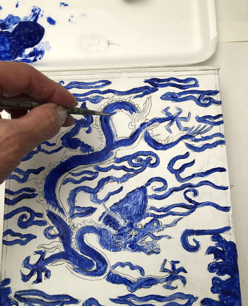 Painting a dragon design blue