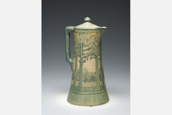 Chocolate pot, c.1909. Low relief of pine tree landscape design. Marie deHoa LeBlanc, decorator; Joseph Meyer, potter. Collection of Mr. Don Fuson.
