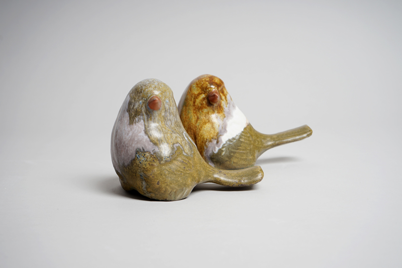 Two ceramic birds