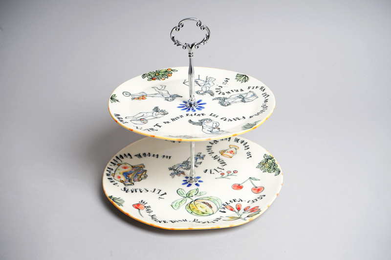White ceramic cake stand with decoration