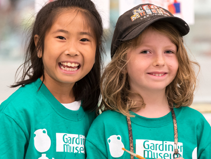 Donate-2 Two young girls smiling and wearing Gardiner Museum t-shirts