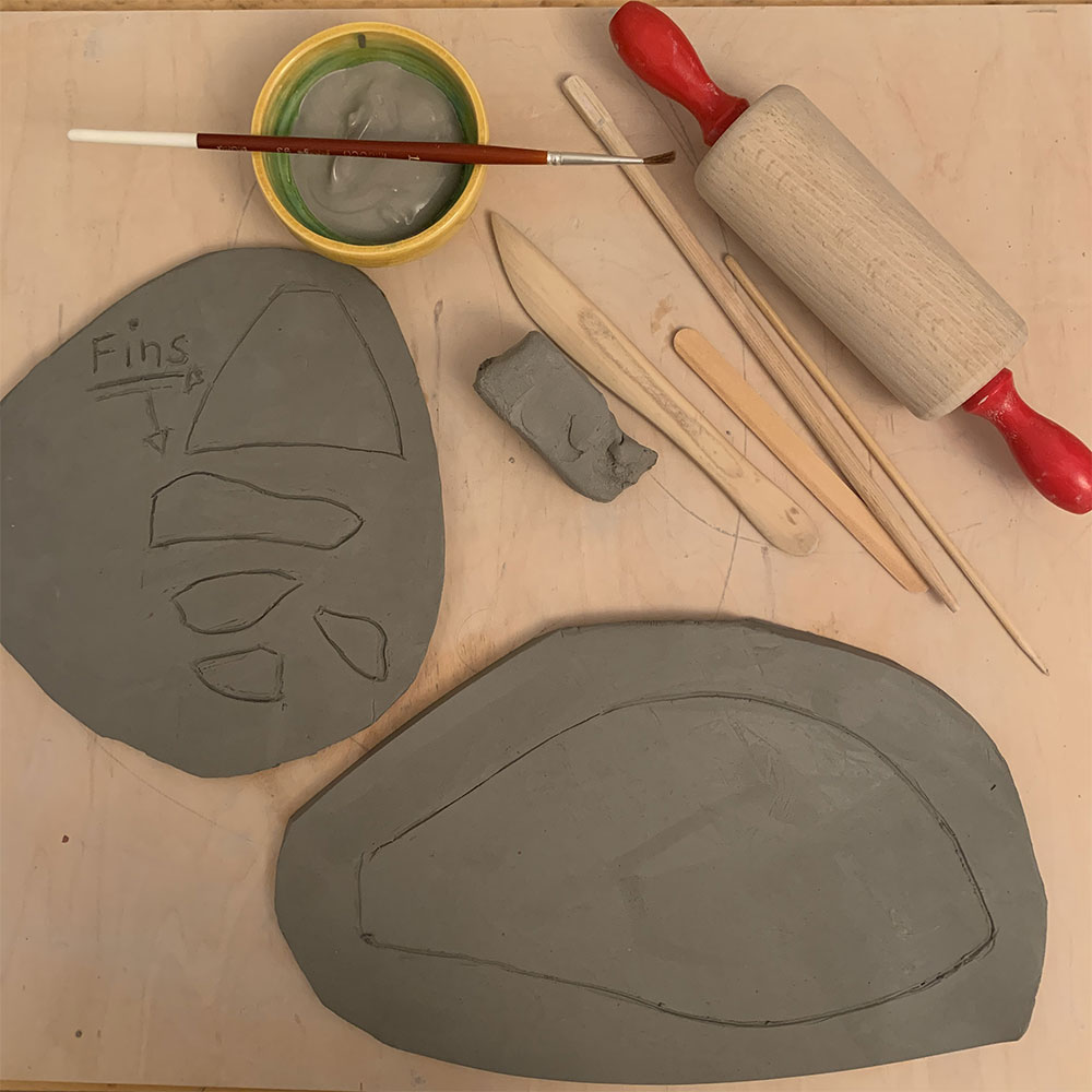 Two slabs of clay and clay tools