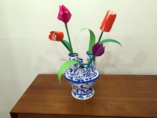 Homemade blue-and-white tulip holder with paper flowers
