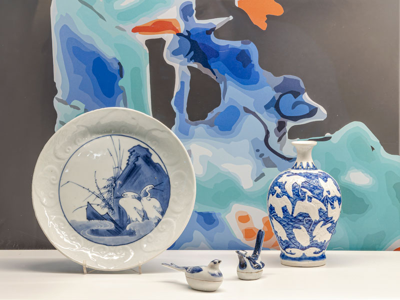 In-Search-of-Imperfection-Thumbnail-2 A glass vitrine with a group of blue and white porcelain objects