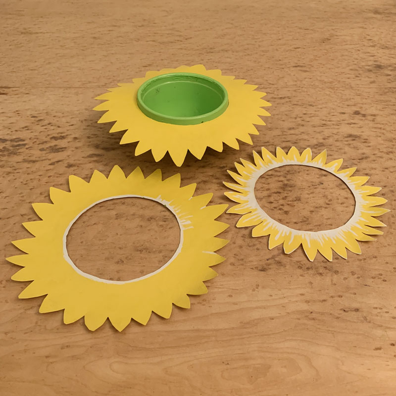 Paper sunflower petals being stacked