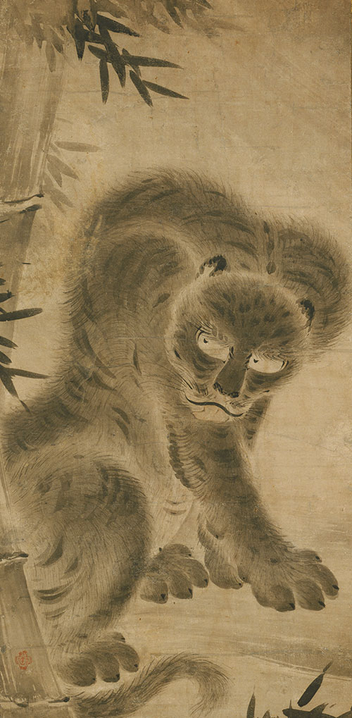 A scroll with a tiger and bamboo design