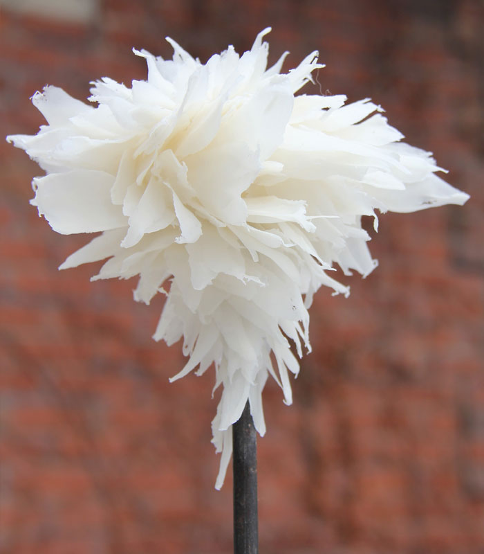 Sculpture made from thin pieces of white clay layered