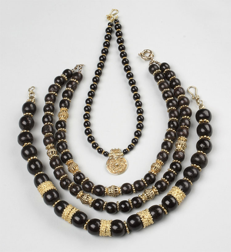 Necklaces made with black coral and antique coins