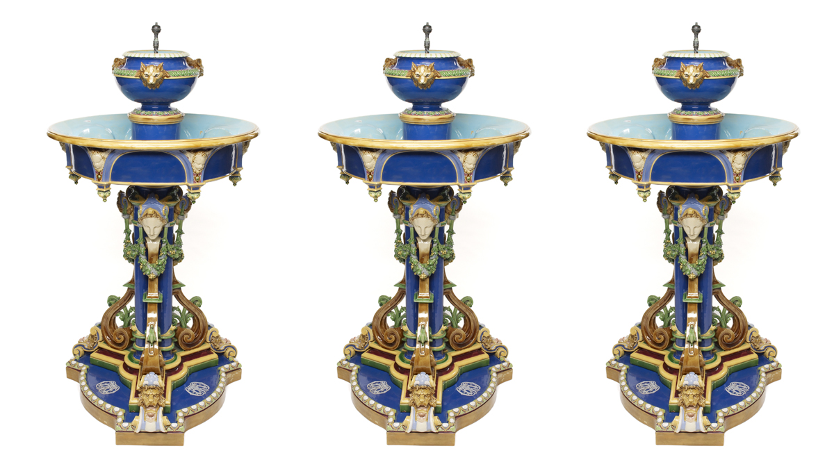 Repeated image of a monogrammed blue fountain with green garlands