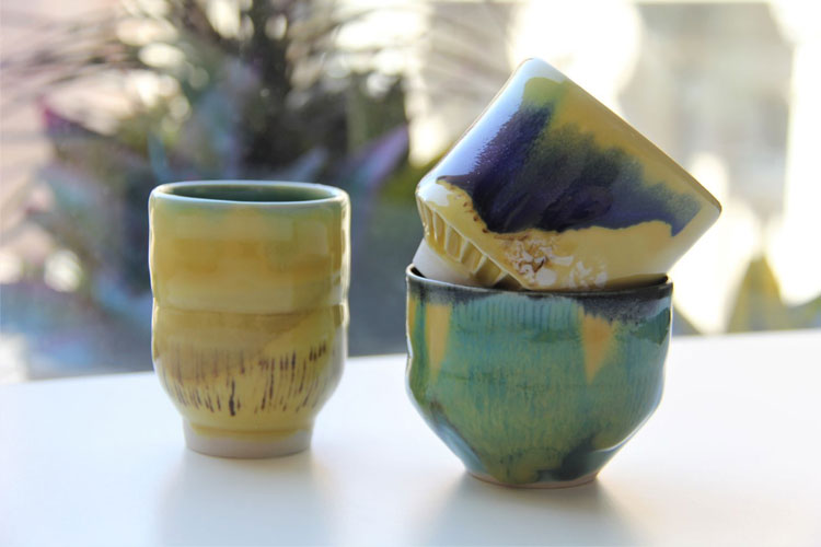 Three small tea bowls in blue and yellow