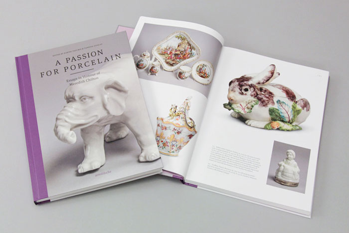 Book with a white ceramic elephant on the cover