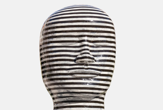 Public-Art-2 Black and silver striped ceramic sculpture of a large head