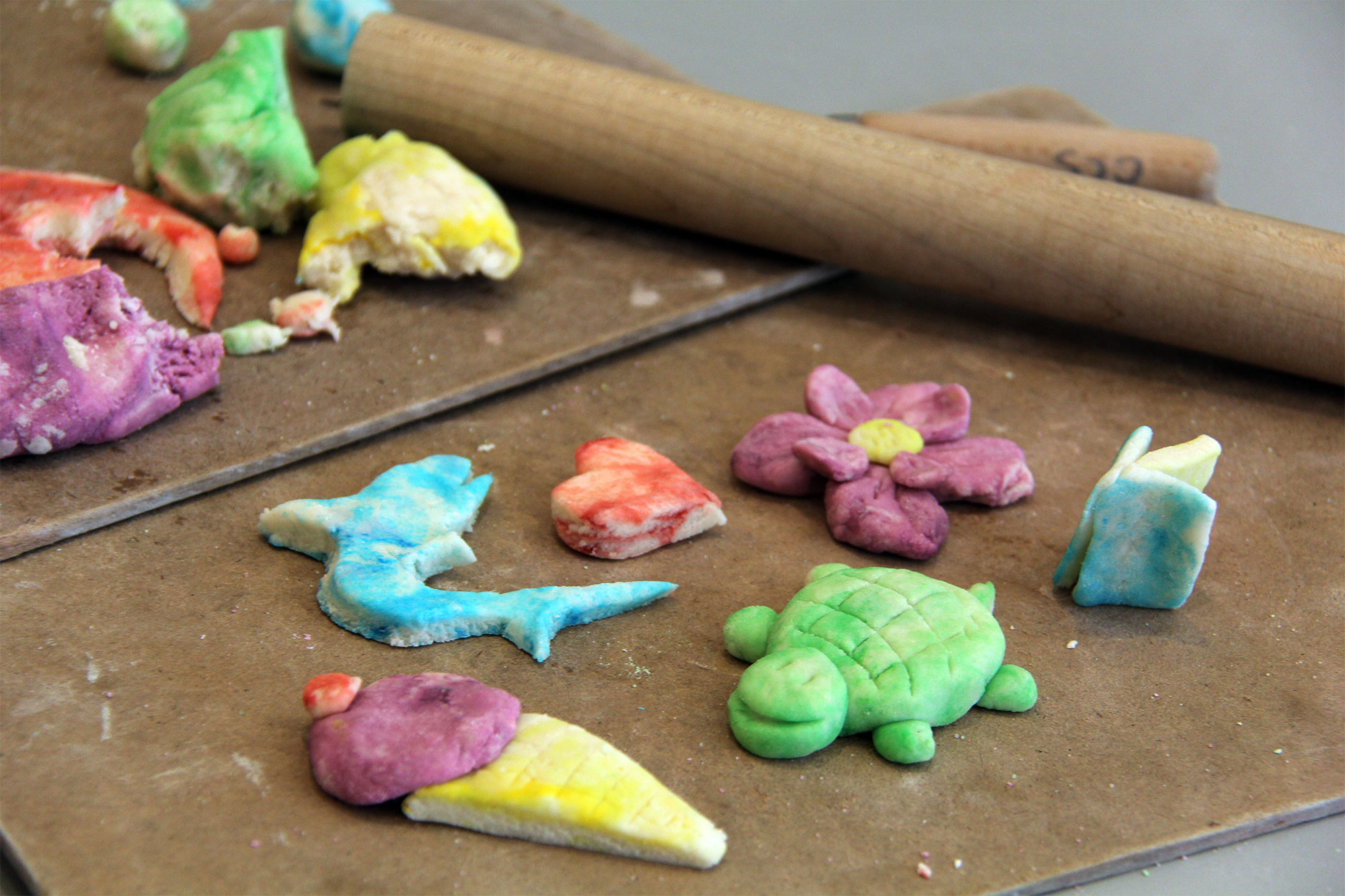 Salt clay objects including a flower, a shark, a turtle, and an ice cream cone